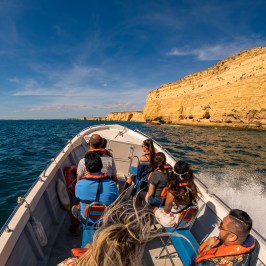 a group of people on a raft in a body of water