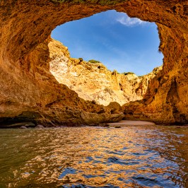 a large body of water with a mountain in the background