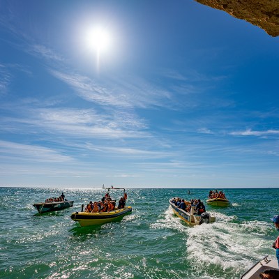 a group of people on a boat in the water