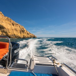 a boat sitting on top of a mountain